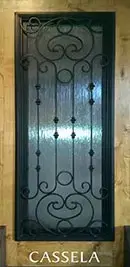 A door with a wrought iron design on it.